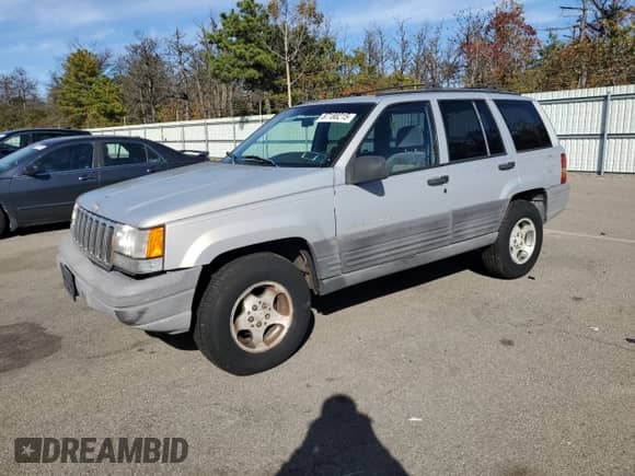 1998 Jeep Grand Cherokee Laredo с VIN 1J4GZ58S1WC195986, выставлен на аукционе Copart как лот 87188215 с пробегом 151 052 миль миль и Чистый • Clean title. История ставок и продаж доступна на DreamBid. Изображение 1.