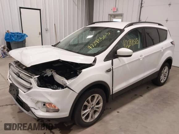 2018 Ford Escape SE z VIN 1FMCU9GD6JUC77191, wystawiony jako IAAI lot #42298565 z przebiegiem 68 806 mil mil oraz . Historia ofert i sprzedaży dostępna na DreamBid. Obrazek 2.