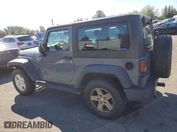 2015 Jeep Wrangler Sport with VIN 1C4AJWAG7FL613059, listed as a Copart auction lot 69094475 with 105,891 mi miles and Salvage title. Bid and sale history available at DreamBid. Image 2.