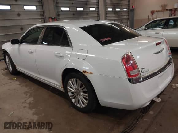 2013 Chrysler 300 with VIN 2C3CCARG6DH505220, listed as a IAAI auction lot 41944437 with 196,548 mi miles and . Bid and sale history available at DreamBid. Image 3.