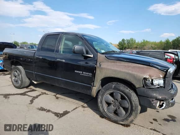 2005 Dodge 1500 SLT with VIN 1D7HA18D05S279772, listed as a Copart auction lot 71243615 with 217,186 mi miles and Salvage title. Bid and sale history available at DreamBid. Image 4.