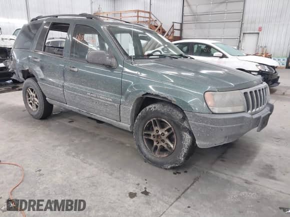 2003 Jeep Grand Cherokee Laredo z VIN 1J4GW48N53C557133, wystawiony jako IAAI lot #41047913 z przebiegiem 199 680 mil mil oraz . Historia ofert i sprzedaży dostępna na DreamBid. Obrazek 1.