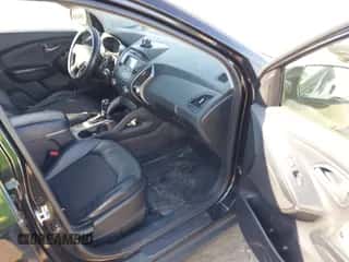 2014 Hyundai Tucson Walking Dead Edition z VIN KM8JUCAG7EU808752, wystawiony jako IAAI lot #43354963 z przebiegiem 184 539 mil mil oraz . Historia ofert i sprzedaży dostępna na DreamBid. Obrazek 5.