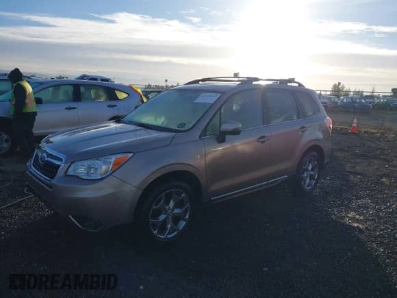 2016 Subaru Forester Touring with VIN JF2SJAXC9GH556784, listed as a IAAI auction lot 43378533 with 72,771 mi miles and . Bid and sale history available at DreamBid. Image 2.
