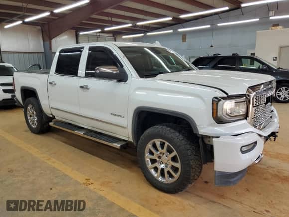 2016 GMC Sierra 1500 Denali z VIN 3GTU2PEJ1GG221537, wystawiony jako Copart lot #80850875 z przebiegiem Nie podano mil oraz Szkoda całkowita • Salvage title. Historia ofert i sprzedaży dostępna na DreamBid. Obrazek 4.