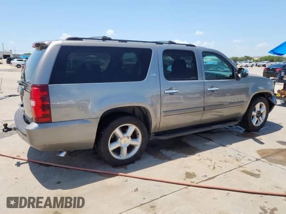 2007 Chevrolet Suburban LTZ с VIN 1GNFC160X7R313925, выставлен на аукционе Copart как лот 65341235 с пробегом 221 393 миль миль и Чистый • Clean title. История ставок и продаж доступна на DreamBid. Изображение 3.