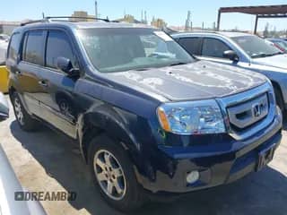 2011 Honda Pilot Touring with VIN 5FNYF3H98BB056455, listed as a IAAI auction lot 42897379 with 173,871 mi miles and . Bid and sale history available at DreamBid. Image 1.