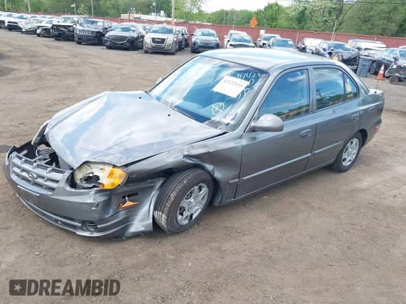 2004 Hyundai Accent GL z VIN KMHCG45C84U514658, wystawiony jako IAAI lot #42222115 z przebiegiem 33 055 mil mil oraz . Historia ofert i sprzedaży dostępna na DreamBid. Obrazek 18.