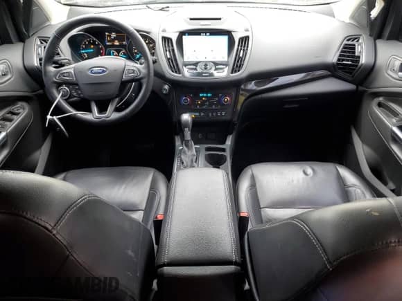 2017 Ford Escape Titanium with VIN 1FMCU0J90HUB64587, listed as a Copart auction lot 86682055 with 64,514 mi miles and Salvage title. Bid and sale history available at DreamBid. Image 8.