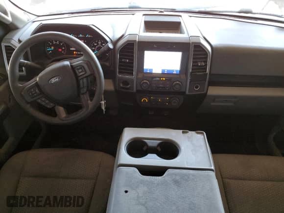 2020 Ford F-150 XL with VIN 1FTEW1C45LKD11814, listed as a Copart auction lot 69002595 with 106,500 mi miles and Salvage title. Bid and sale history available at DreamBid. Image 8.