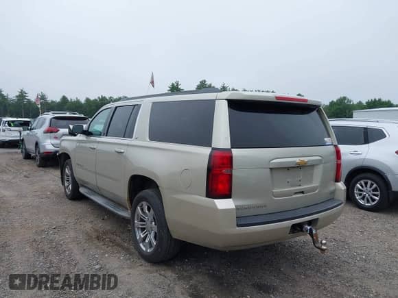 2015 Chevrolet Suburban LT with VIN 1GNSKJKC5FR569101, listed as a IAAI auction lot 42631110 with 183,729 mi miles and . Bid and sale history available at DreamBid. Image 3.