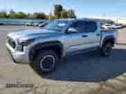 2024 Toyota Tacoma TRD Off Road with VIN 3TMLB5JN8RM000837, listed as a Copart auction lot 82183745 with 14,184 mi miles and Salvage title. Bid and sale history available at DreamBid. Image 1.
