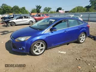 2013 Ford Focus Titanium with VIN 1FADP3J22DL113473, listed as a Copart auction lot 69153185 with 109,640 mi miles and Salvage title. Bid and sale history available at DreamBid. Image 1.