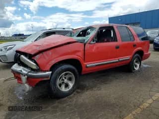 2001 Chevrolet Blazer LT z VIN 1GNCS13W812199664, wystawiony jako Copart lot #70147585 z przebiegiem Nie podano mil oraz Czysty tytuł • Clean title. Historia ofert i sprzedaży dostępna na DreamBid. Obrazek 1.