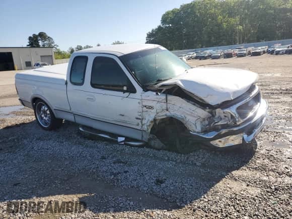 1997 Ford F-150 XL z VIN 1FTEX17L5VNC51677, wystawiony jako Copart lot #52109775 z przebiegiem 285 473 mil mil oraz Szkoda całkowita • Salvage title. Historia ofert i sprzedaży dostępna na DreamBid. Obrazek 4.