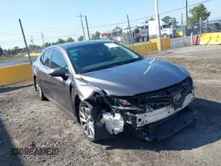 2019 Toyota Camry SE z VIN 4T1B11HK5KU750793, wystawiony jako IAAI lot #43209555 z przebiegiem 144 832 mil mil oraz . Historia ofert i sprzedaży dostępna na DreamBid. Obrazek 1.