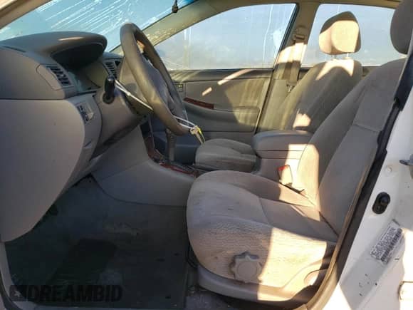 2003 Toyota Corolla LE with VIN 1NXBR32E03Z057316, listed as a Copart auction lot 86867285 with 194,859 mi miles and Clean title. Bid and sale history available at DreamBid. Image 7.