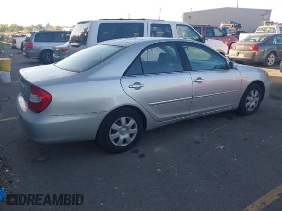 2003 Toyota Camry LE with VIN JTDBE32K130187036, listed as a IAAI auction lot 43504391 with 205,170 mi miles and . Bid and sale history available at DreamBid. Image 4.