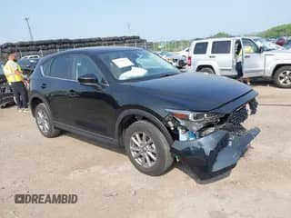 2022 Mazda CX-5 S Carbon Edition z VIN JM3KFBCM0N0623991, wystawiony jako IAAI lot #42434878 z przebiegiem 33 120 mil mil oraz . Historia ofert i sprzedaży dostępna na DreamBid. Obrazek 1.