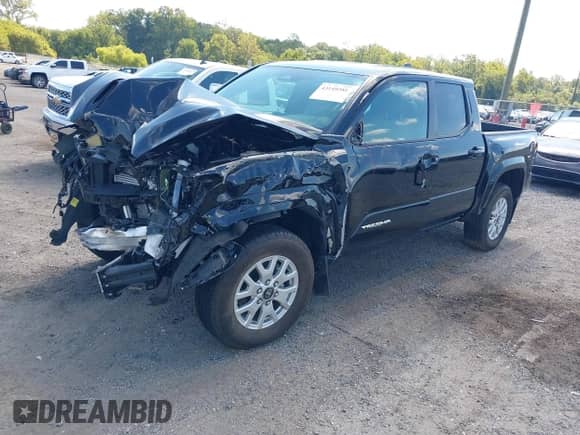 2024 Toyota Tacoma SR5 with VIN 3TMLB5JN7RM077957, listed as a IAAI auction lot 43149381 with 11,806 mi miles and . Bid and sale history available at DreamBid. Image 17.