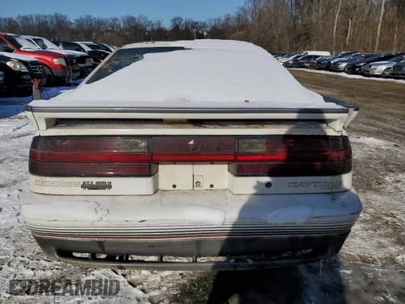 1989 Dodge Daytona with VIN 1B3XG74A5KG113363, listed as a Copart auction lot 88239065 with 209,485 mi miles and Salvage title. Bid and sale history available at DreamBid. Image 6.