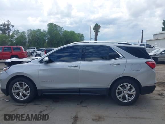 2018 Chevrolet Equinox LT z VIN 2GNAXKEX2J6155117, wystawiony jako IAAI lot #43252814 z przebiegiem 115 406 mil mil oraz . Historia ofert i sprzedaży dostępna na DreamBid. Obrazek 15.