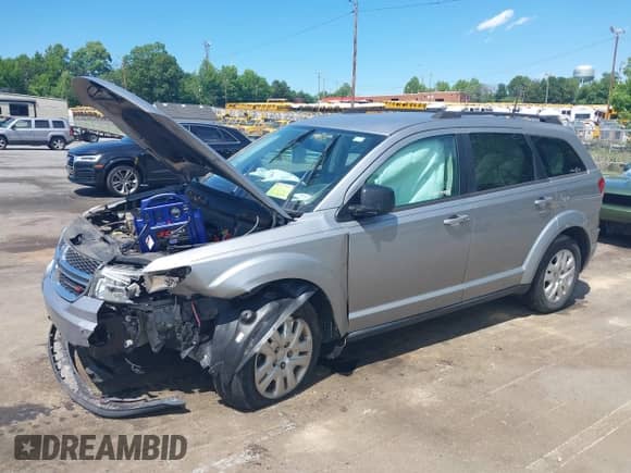 2019 Dodge Journey SE Value with VIN 3C4PDCAB7KT870550, listed as a IAAI auction lot 42327883 with 128,002 mi miles and . Bid and sale history available at DreamBid. Image 2.