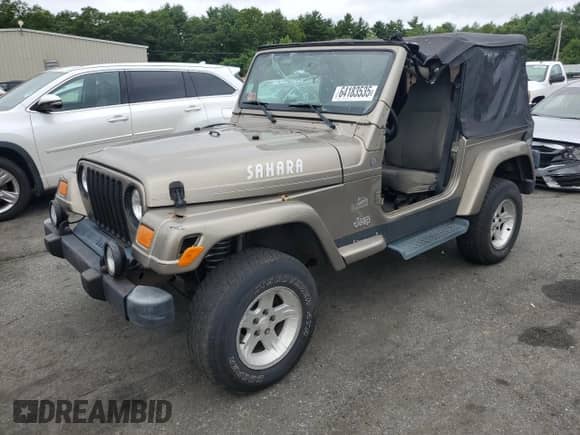 2004 Jeep Wrangler Sahara с VIN 1J4FA59S84P801582, выставлен на аукционе Copart как лот 64183535 с пробегом 127 213 миль миль и Списание • Salvage title. История ставок и продаж доступна на DreamBid. Изображение 1.