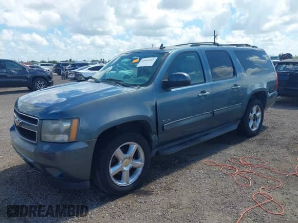 2010 Chevrolet Suburban LT z VIN 1GNUCJE01AR142336, wystawiony jako IAAI lot #42569262 z przebiegiem 298 479 mil mil oraz . Historia ofert i sprzedaży dostępna na DreamBid. Obrazek 2.
