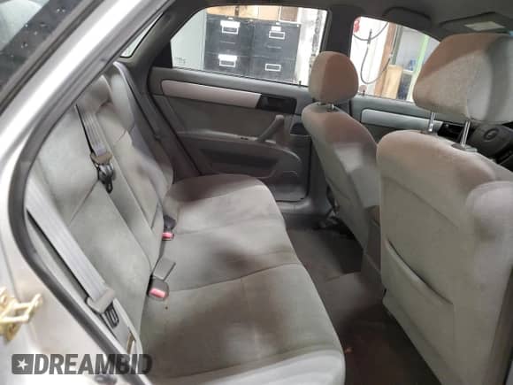 2005 Chevrolet Optra LS с VIN KL1JK59Z05K207455, выставлен на аукционе Copart как лот 79134294 с пробегом 209 198 миль миль и Чистый • Clean title. История ставок и продаж доступна на DreamBid. Изображение 10.