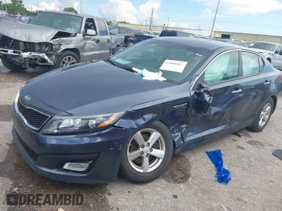 2015 Kia Optima LX with VIN 5XXGM4A73FG488602, listed as a IAAI auction lot 43008817 with 87,198 mi miles and . Bid and sale history available at DreamBid. Image 2.