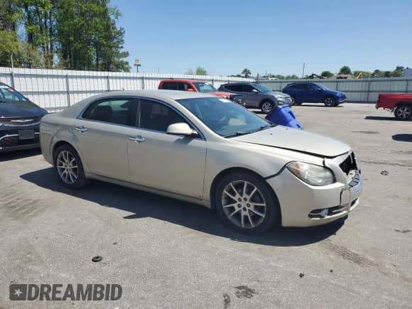 2009 Chevrolet Malibu LTZ with VIN 1G1ZK57B29F185810, listed as a Copart auction lot 50023505 with 188,443 mi miles and Salvage title. Bid and sale history available at DreamBid. Image 4.
