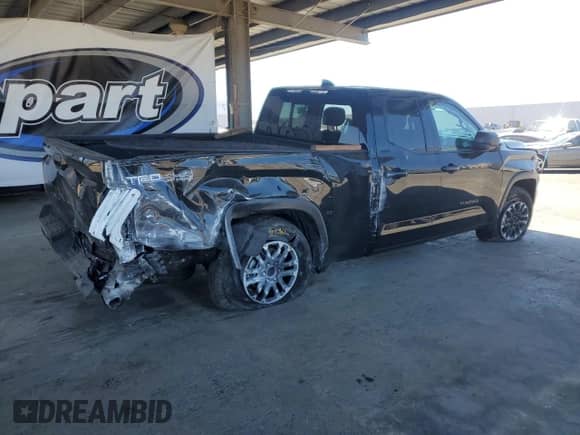 2023 Toyota Tundra SR5 with VIN 5TFLA5DA7PX129459, listed as a Copart auction lot 67829615 with 59,761 mi miles and Salvage title. Bid and sale history available at DreamBid. Image 3.