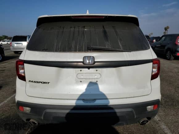 2020 Honda Passport EX-L with VIN 5FNYF7H57LB004207, listed as a Copart auction lot 67420715 with 76,324 mi miles and Salvage title. Bid and sale history available at DreamBid. Image 6.