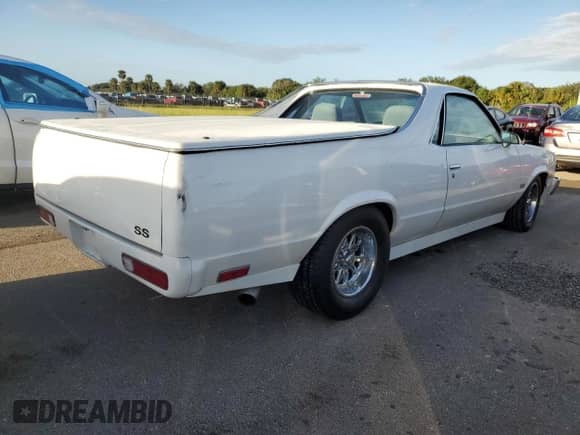 1986 Chevrolet El Camino SS с VIN 3GCCW80H9GS916596, выставлен на аукционе Copart как лот 74758864 с пробегом Не указан миль и Списание • Salvage title. История ставок и продаж доступна на DreamBid. Изображение 3.