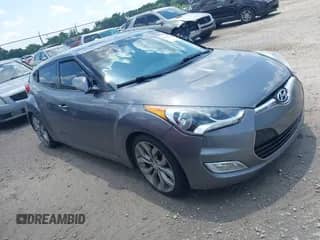 2012 Hyundai Veloster w/Black Int z VIN KMHTC6ADXCU061325, wystawiony jako IAAI lot #42556398 z przebiegiem 122 954 mil mil oraz . Historia ofert i sprzedaży dostępna na DreamBid. Obrazek 1.
