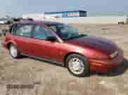 1999 Saturn SW with VIN 1G8ZK827XXZ348270, listed as a Copart auction lot 67872244 with 110,936 mi miles and Salvage title. Bid and sale history available at DreamBid. Image 4.