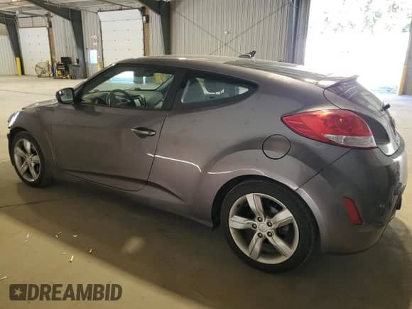 2015 Hyundai Veloster z VIN KMHTC6AD5FU243986, wystawiony jako Copart lot #84944785 z przebiegiem 67 979 mil mil oraz Szkoda całkowita • Salvage title. Historia ofert i sprzedaży dostępna na DreamBid. Obrazek 2.