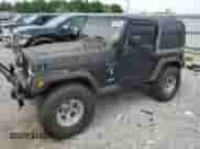 2000 Jeep Wrangler Sport z VIN 1J4FA49S7YP741858, wystawiony jako Copart lot #59058075 z przebiegiem 223 876 mil mil oraz Czysty tytuł • Clean title. Historia ofert i sprzedaży dostępna na DreamBid. Obrazek 1.