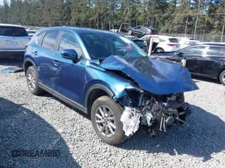 2023 Mazda CX-5 S Preferred z VIN JM3KFBCM9P0258634, wystawiony jako IAAI lot #42224168 z przebiegiem 9 519 mil mil oraz . Historia ofert i sprzedaży dostępna na DreamBid. Obrazek 1.
