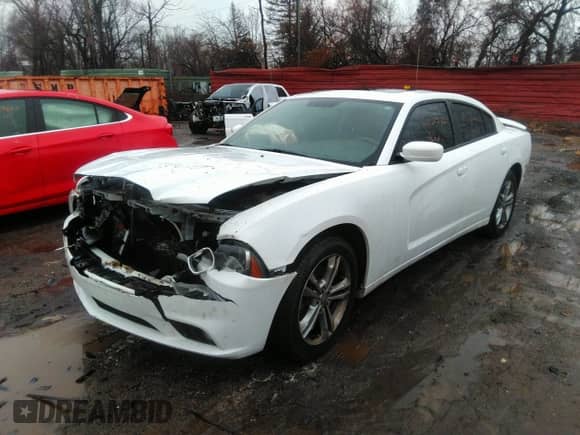 2013 Dodge Charger SXT with VIN 2C3CDXJG9DH541155, listed as a IAAI auction lot 41123246 with 118,392 mi miles and . Bid and sale history available at DreamBid. Image 2.