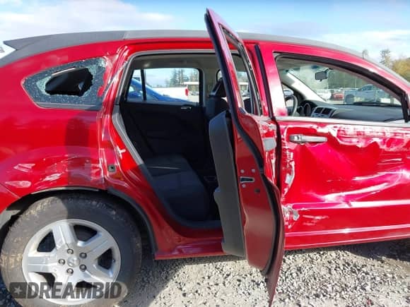 2009 Dodge Caliber SE with VIN 1B3HB28A39D101899, listed as a IAAI auction lot 43409914 with 128,378 mi miles and . Bid and sale history available at DreamBid. Image 8.