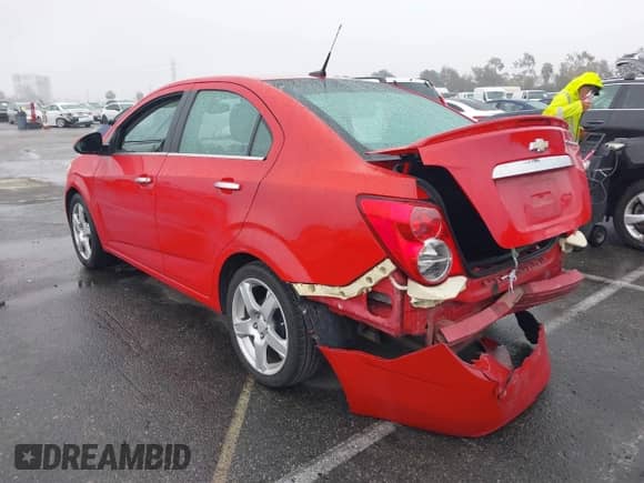 2013 Chevrolet Sonic LTZ with VIN 1G1JE5SH6D4136632, listed as a IAAI auction lot 41554261 with 85,006 mi miles and . Bid and sale history available at DreamBid. Image 3.