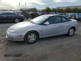 2001 Saturn SC with VIN 1G8ZY14701Z255767, listed as a Copart auction lot 53727985 with 137,776 mi miles and Salvage title. Bid and sale history available at DreamBid. Image 1.