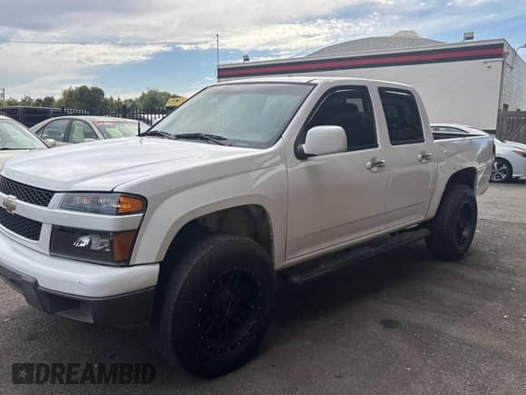 2011 Chevrolet Colorado 1LT z VIN 1GCHTCFE3B8106686, wystawiony jako Copart lot #70392165 z przebiegiem 157 398 mil mil oraz Czysty tytuł • Clean title. Historia ofert i sprzedaży dostępna na DreamBid. Obrazek 2.