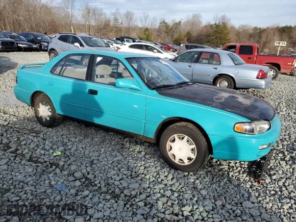1995 Toyota Camry DX z VIN 4T1SK11E7SU597237, wystawiony jako Copart lot #43271845 z przebiegiem 237 581 mil mil oraz Szkoda całkowita • Salvage title. Historia ofert i sprzedaży dostępna na DreamBid. Obrazek 4.