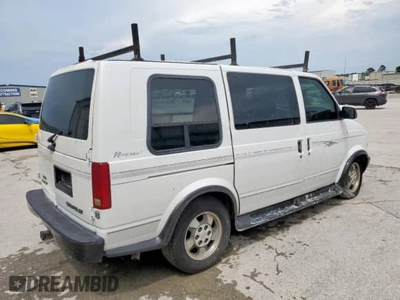 2003 Chevrolet Astro Cargo YF7 Upfitter z VIN 1GBDM19X63B136142, wystawiony jako Copart lot #68472405 z przebiegiem 237 395 mil mil oraz Szkoda całkowita • Salvage title. Historia ofert i sprzedaży dostępna na DreamBid. Obrazek 3.
