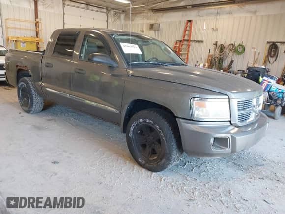 2008 Dodge Dakota Laramie with VIN 1D7HW58N58S602395, listed as a IAAI auction lot 42062915 with 166,161 mi miles and . Bid and sale history available at DreamBid. Image 1.