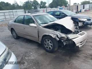 1997 Toyota Camry LE z VIN 4T1BF22K5VU923734, wystawiony jako IAAI lot #43278188 z przebiegiem 164 078 mil mil oraz . Historia ofert i sprzedaży dostępna na DreamBid. Obrazek 1.