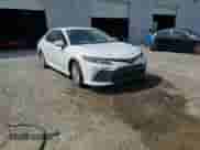 2023 Toyota Camry LE z VIN 4T1C11AK8PU827730, wystawiony jako Copart lot #70106645 z przebiegiem Nie podano mil oraz Czysty tytuł • Clean title. Historia ofert i sprzedaży dostępna na DreamBid. Obrazek 13.